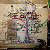 I place all the terminal connections and resistor networks inside the bottom of the panel.  Only wires run under the layout.