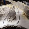 An island splits the water flow before it plunges over Cataract Falls in the foreground.  The rock castings rest on a thin sheet of Styrofoam that will provide support for their subsequent removal.