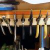 Pliers rack was made from 1"x2" pine with angled holes.  It is very accessible and keeps tools off of the work surface. It is located directly in front of me.